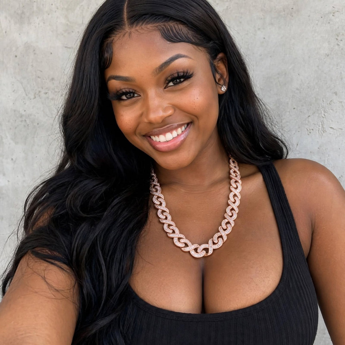 Model wearing rose gold infinity-link chain