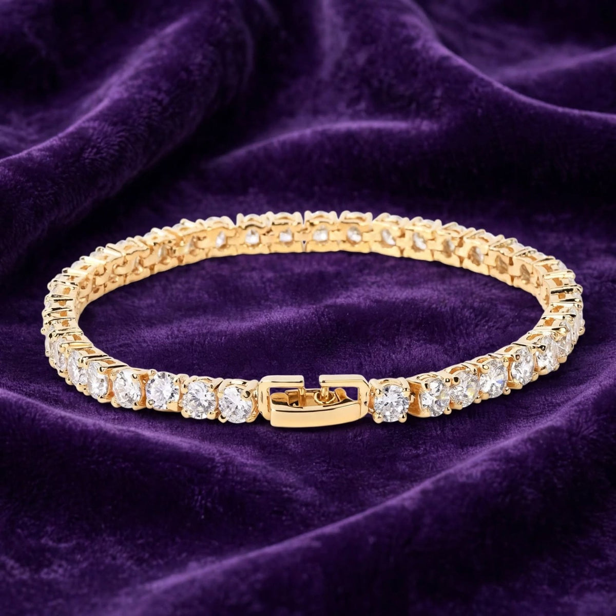 Gold CZ tennis bracelet with clasp on purple velvet