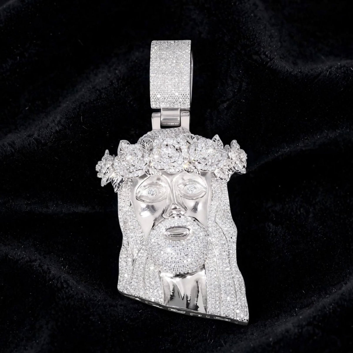 Silver Jesus rose-crown pendant on black velvet