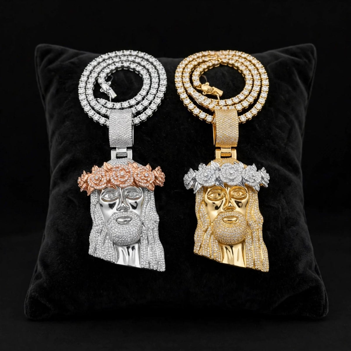 Silver and gold Jesus head pendants with iced floral crowns on black velvet