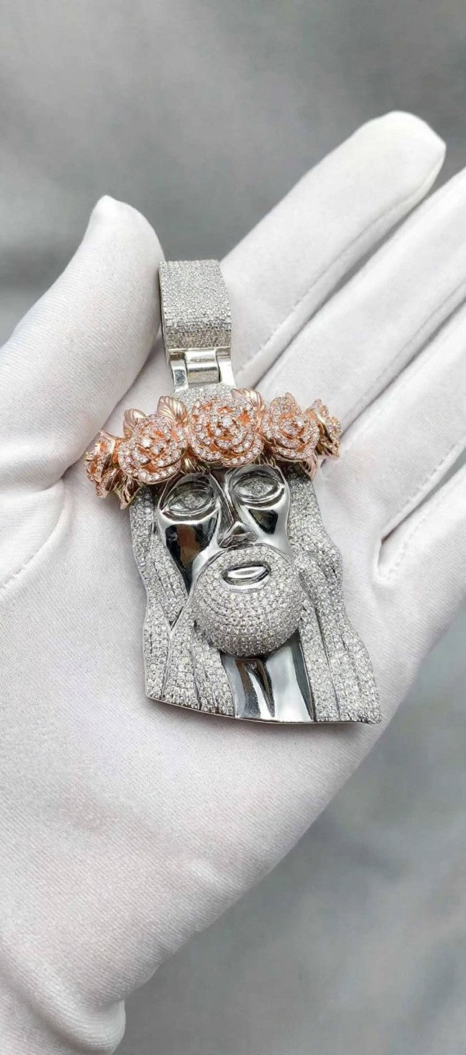 Silver pendant with rose-gold floral crown on white glove