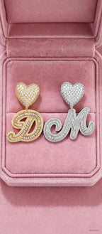 Gold D and silver M pendants in pink velvet box
