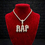 Talk That Talk custom iced-out RAP pendant on red velvet jewelry bust