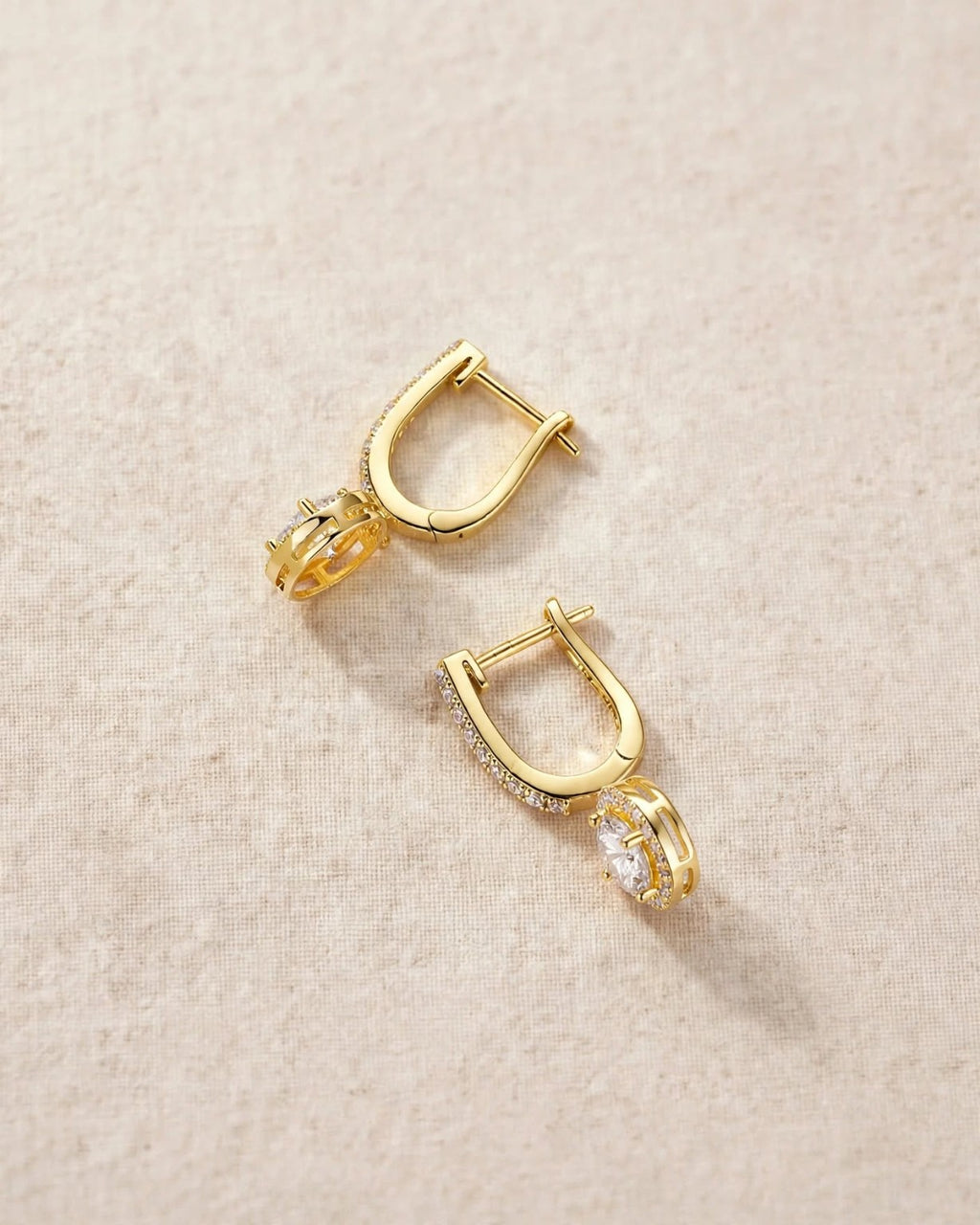 Rear and clasp details of gold-tone moissanite dangle earrings