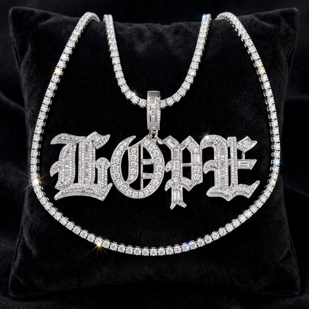 Silver Old English HOPE iced-out baguette pendant with tennis chain displayed on black velvet