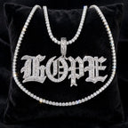 Silver Old English HOPE iced-out baguette pendant with tennis chain displayed on black velvet