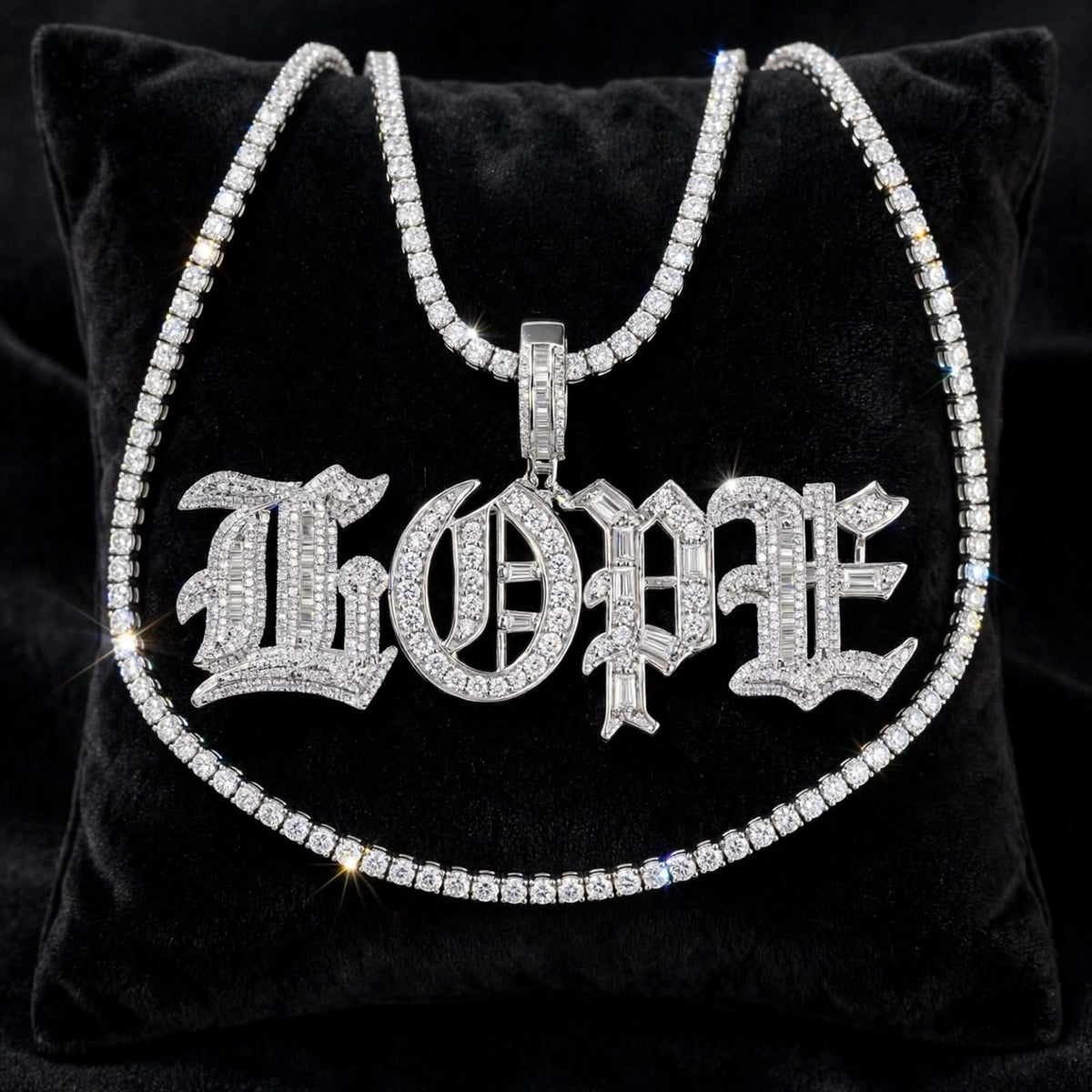 Silver Old English HOPE iced-out baguette pendant with tennis chain displayed on black velvet