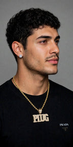 The Plug CZ pendant in gold color; chain shown for styling, sold separately