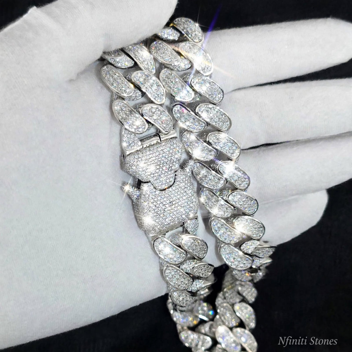 The Vault Silver links and iced clasp close-up