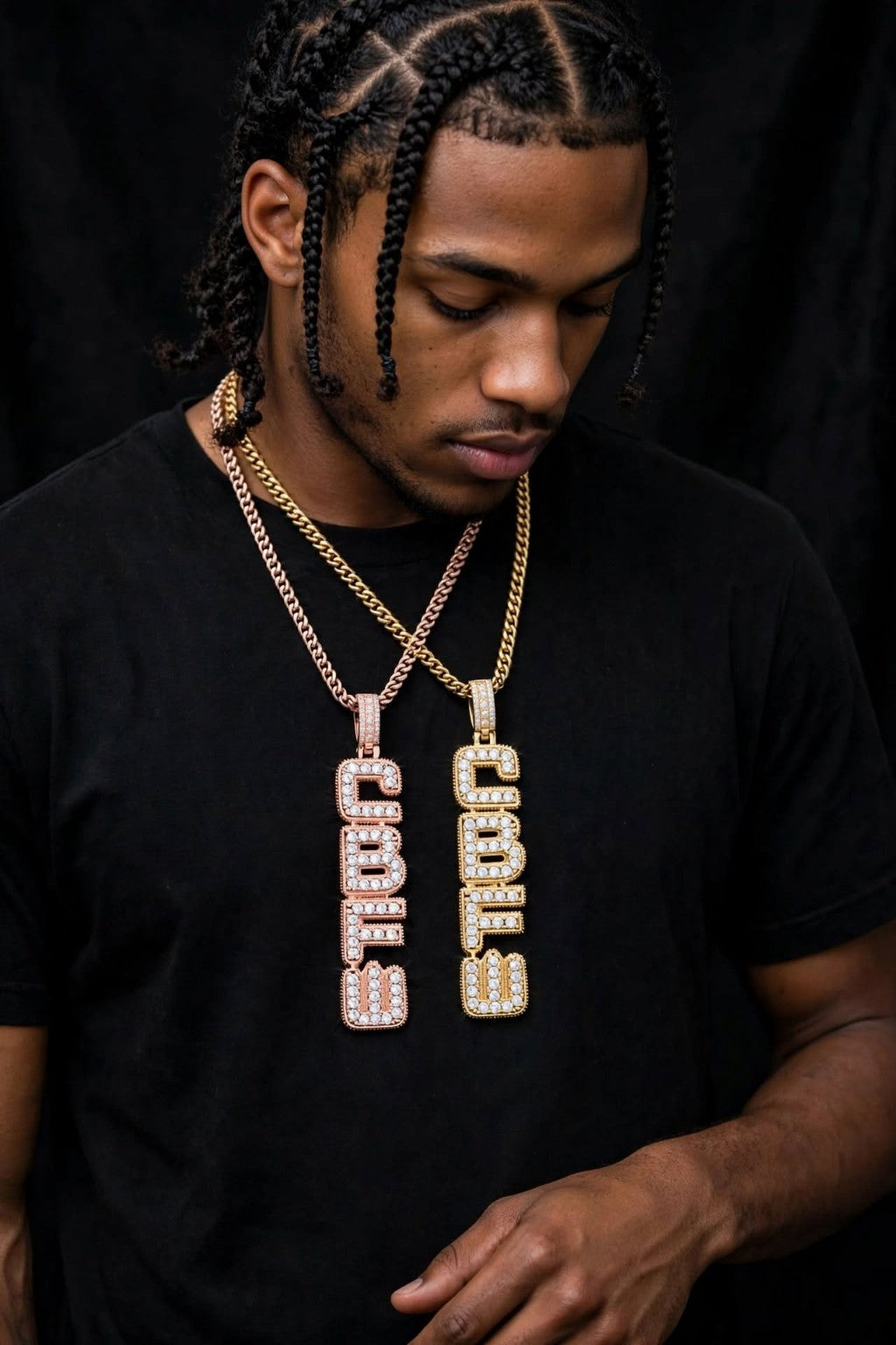 Model wearing two Vertical Flex custom CZ pendants in gold and rose gold